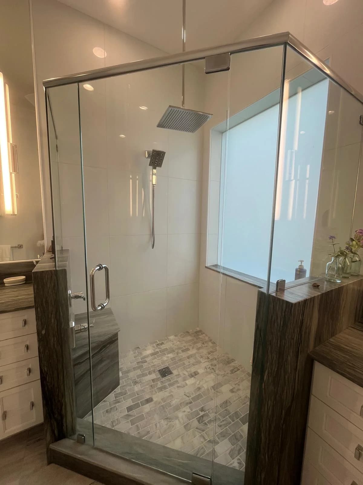 A glass shower enclosure cleaned to a streak-free shine.